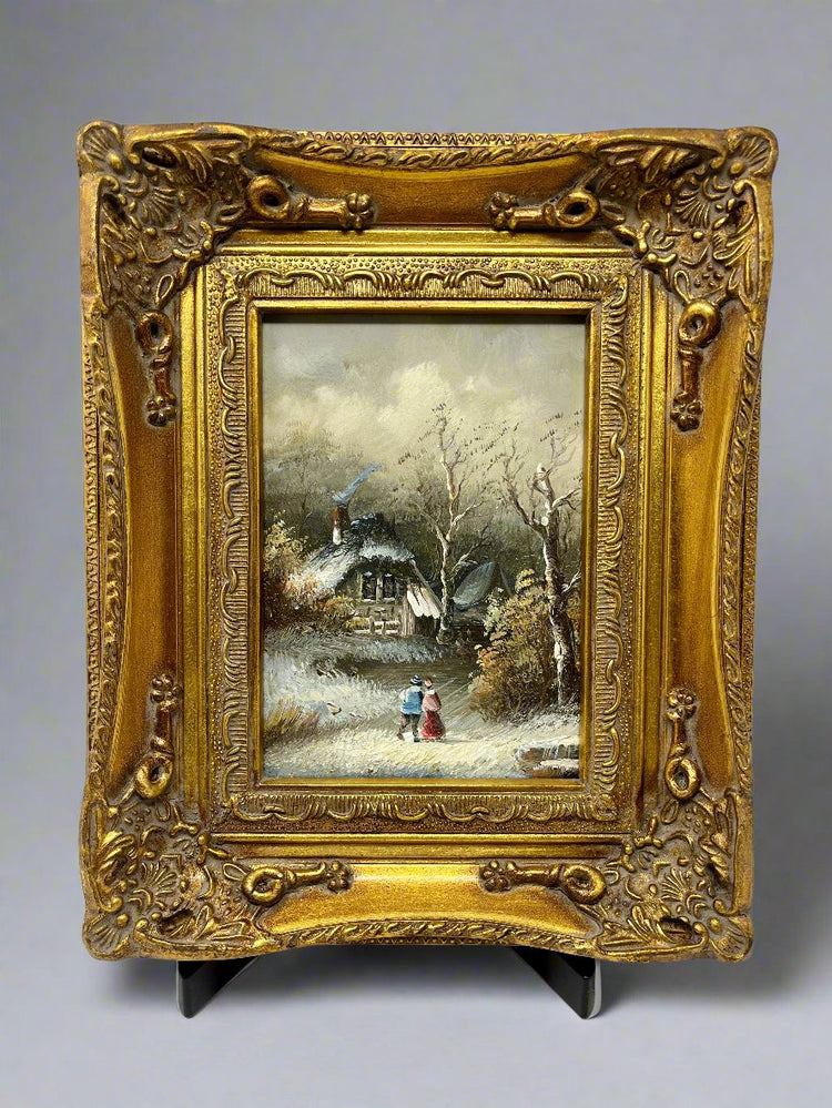 Winter cottage with man and woman standing outside