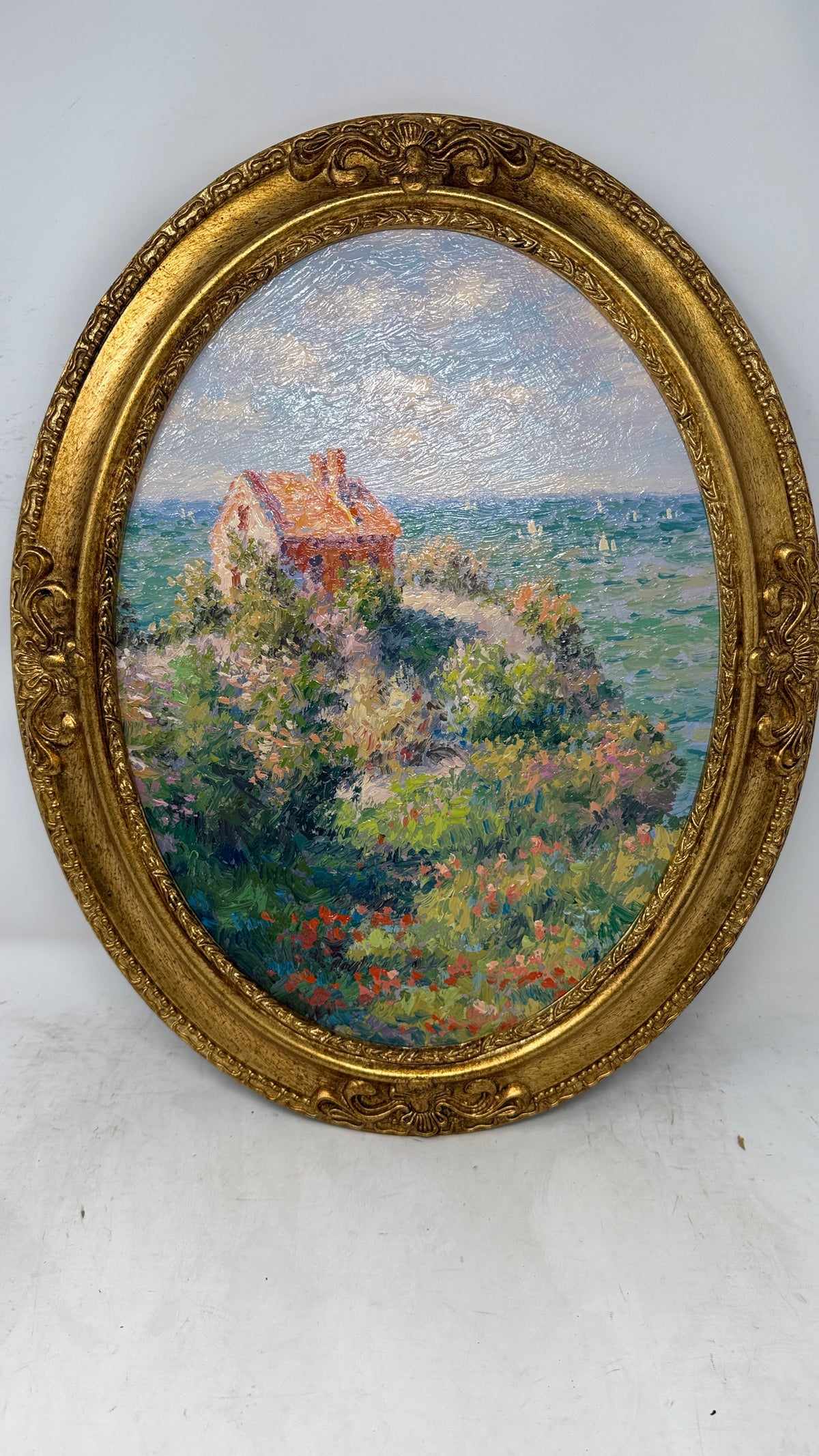 Seaside Cottage in Bloom – Impressionist Coastal Oil Painting in Ornate Gold Oval Frame